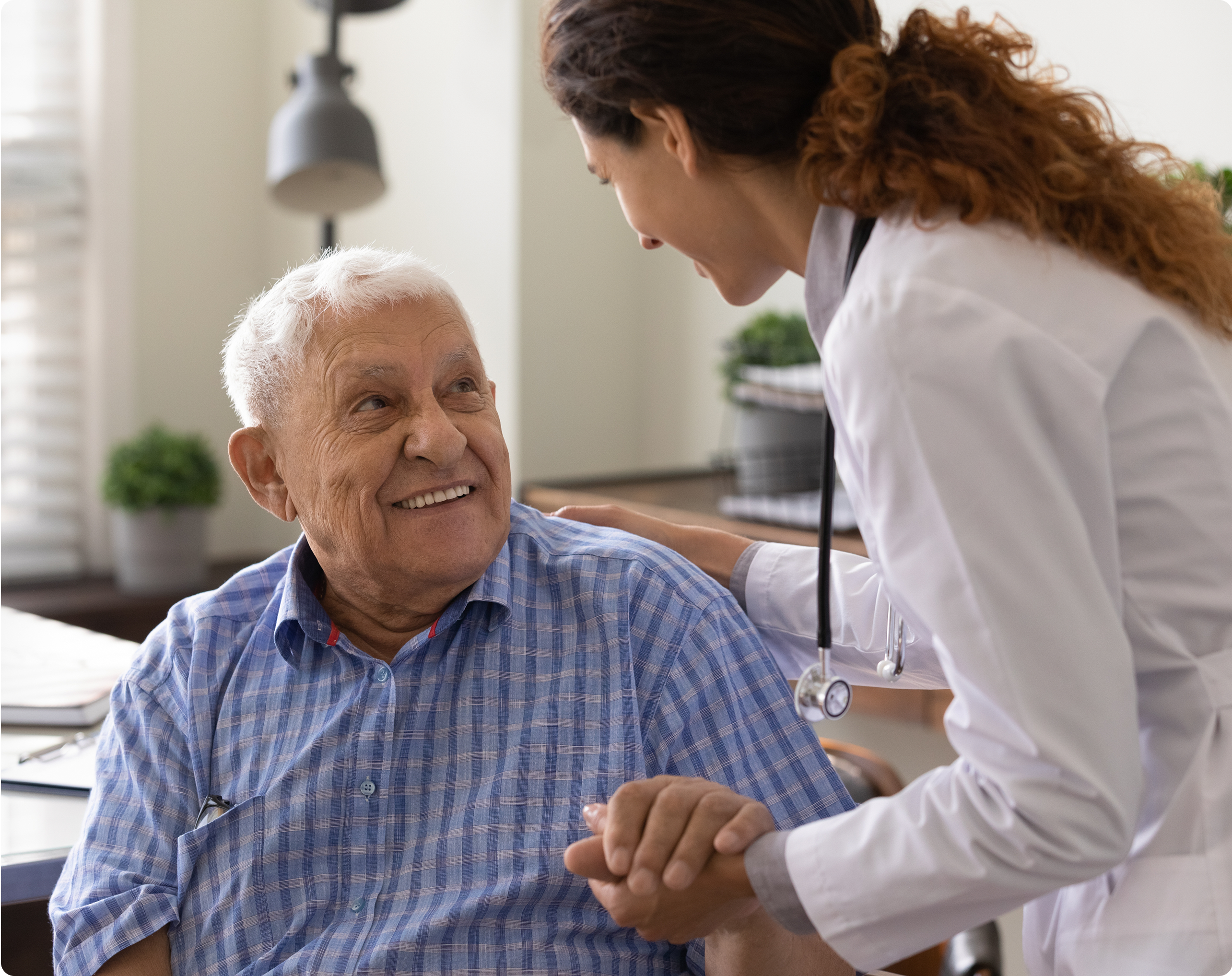 Old man young woman doctor smiling