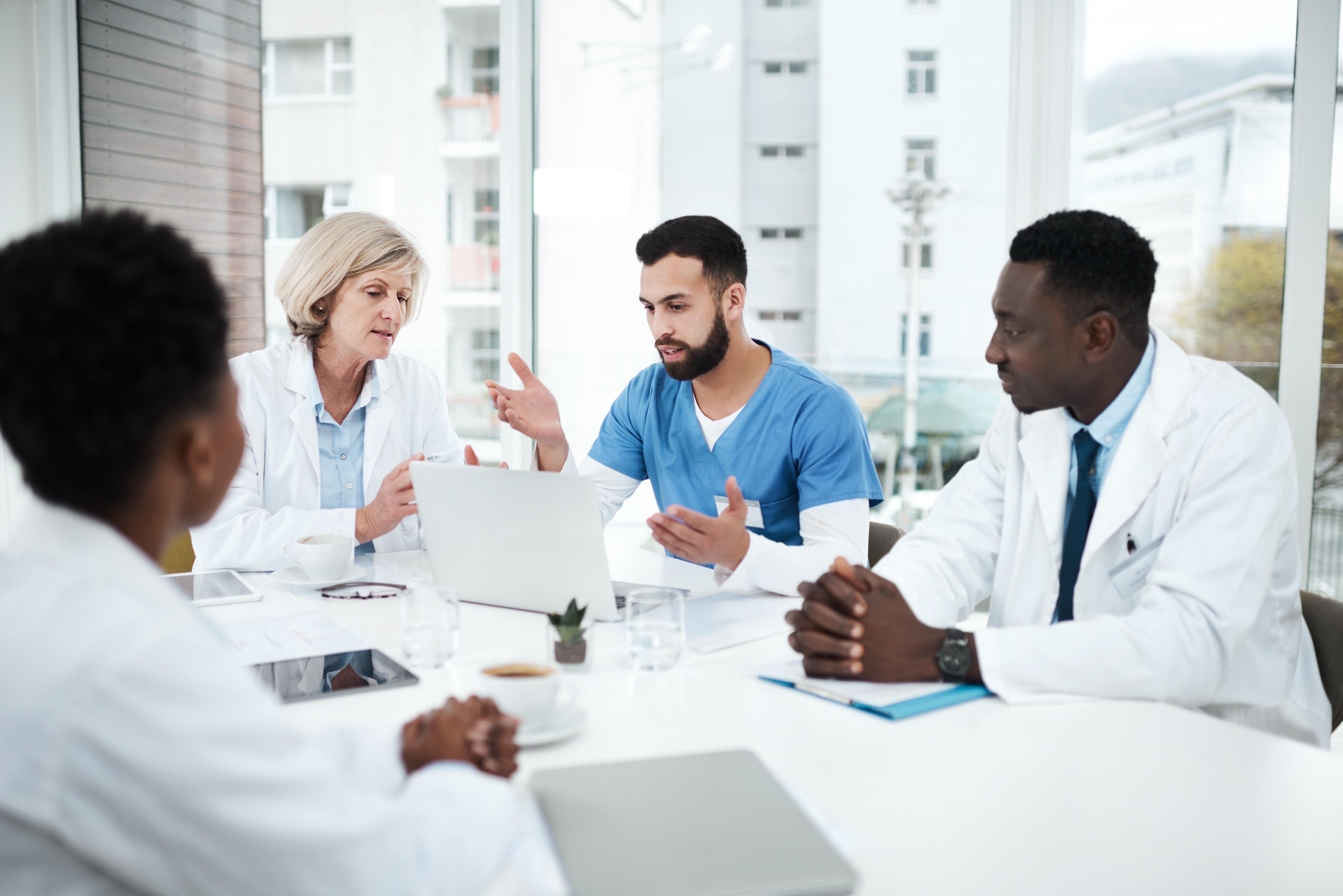 Health care team discussing at a table